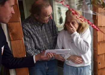 Jo-Ann Snyder receives the check from Publishers Clearing House at her home in Wilkes-Barre, Pa., in 2018.