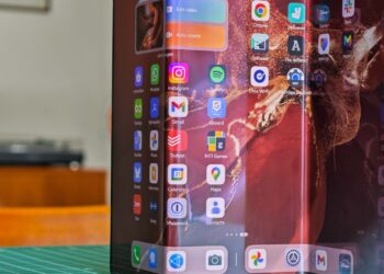 Huawei Mate XT standing open on a table