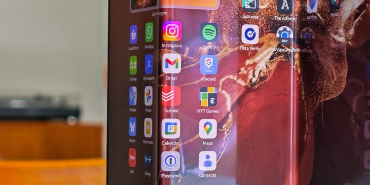 Huawei Mate XT standing open on a table