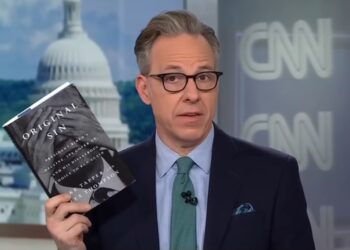 Tapper holding his Book "Original Sin"