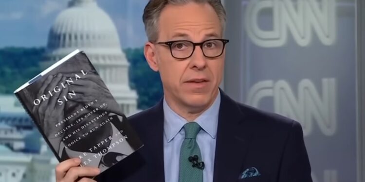 Tapper holding his Book "Original Sin"