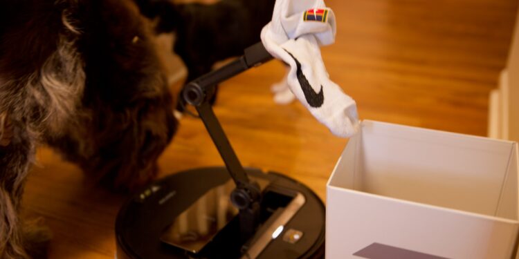 The Z70 can take objects it picks up to designated areas, including this box Roborock supplies with the robot.