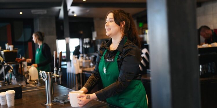 Barista wearing uniform.