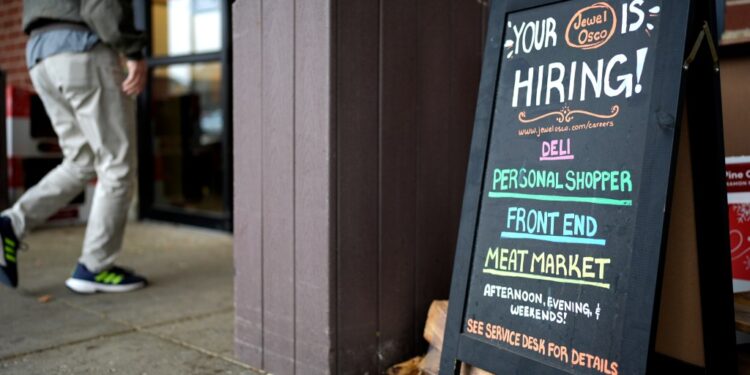 Hiring sign at a grocery store.