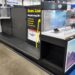 Empty shelves, missing price tags and lockers in the DJI section of Best Buy.