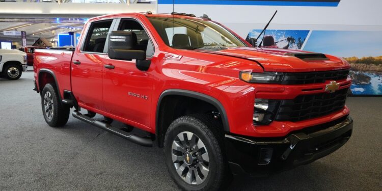 Red 2024 Chevrolet Silverado 2500 HD Custom truck.