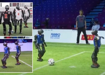 Humanoid robots compete in 3-on-3 soccer game