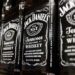 Several bottles of Jack Daniel's Tennessee Whiskey on a shelf.