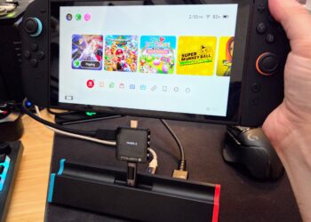 A third-party Switch dock, plugged into a USB-C PD tester, about to be plugged into the Switch 2. Please forgive the terrible photo.