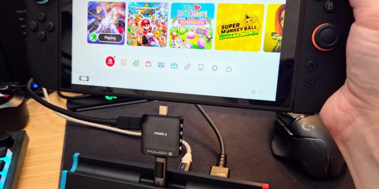 A third-party Switch dock, plugged into a USB-C PD tester, about to be plugged into the Switch 2. Please forgive the terrible photo.