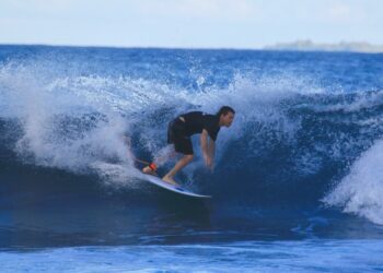 Surfer riding a wave.