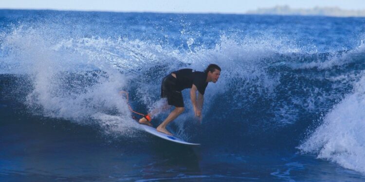 Surfer riding a wave.