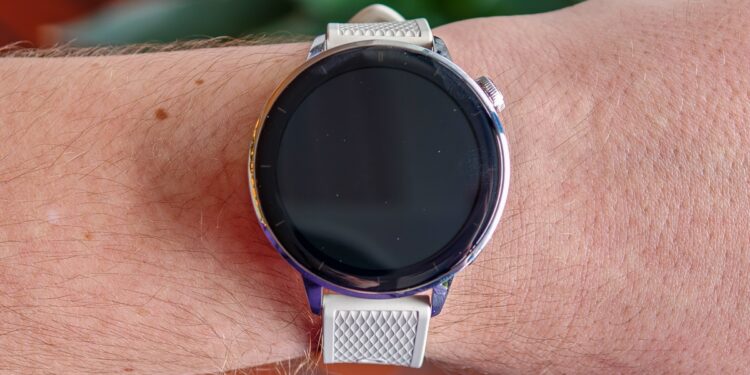 OnePlus Watch 3 43mm on a man’s wrist with the screen off