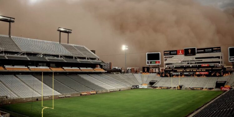 Arizona State University's Mountain America Stadium engulfed by a massive dust storm.
