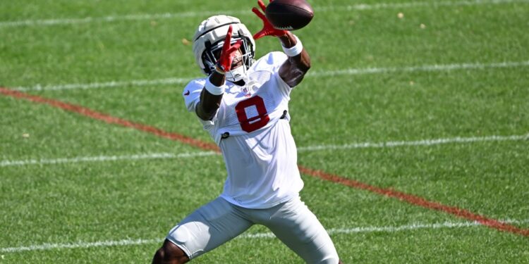 Football player catching a pass.
