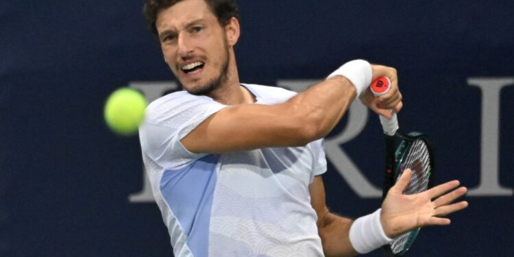 Pablo Carreno Busta playing tennis.