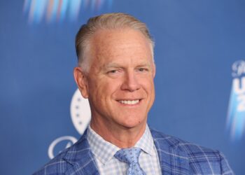 Headshot of a man in a blue blazer.