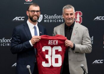 Andrew Luck and Frank Reich at a Stanford football press conference.