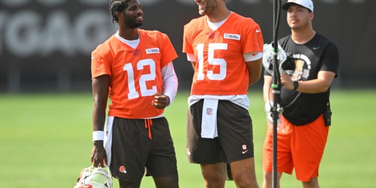 Cleveland Browns quarterback Shedeur Sanders (12) talks to quarterback Joe Flacco (15) during a practice at the team's NFL football training camp Saturday, July 26, 2025, in Berea, Ohio.