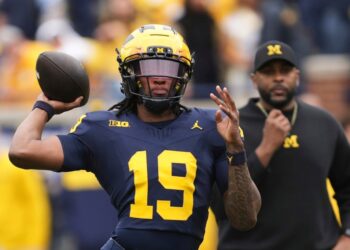 Michigan quarterback Bryce Underwood throwing a football.