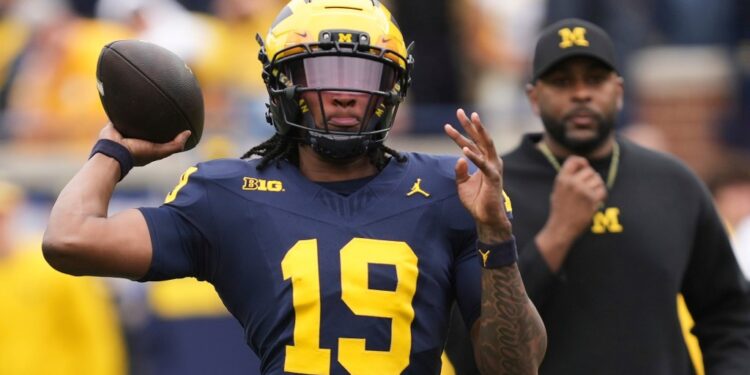 Michigan quarterback Bryce Underwood throwing a football.