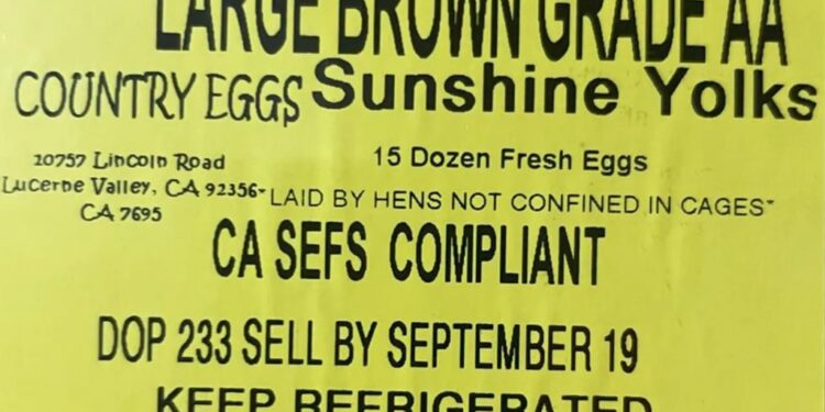 Country Eggs Sunshine Yolks sticker with product information.