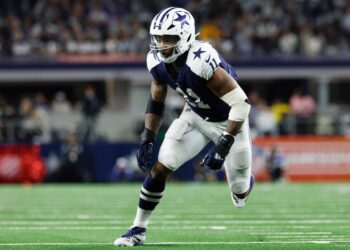 Micah Parsons, Dallas Cowboys linebacker, running on the field.
