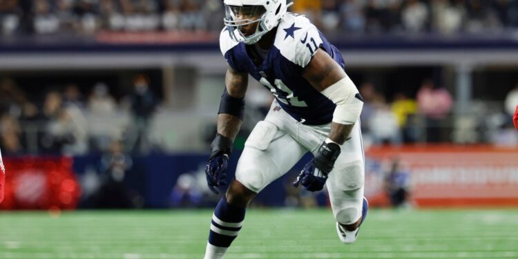 Micah Parsons, Dallas Cowboys linebacker, running on the field.