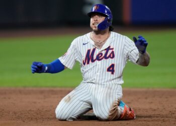 New York Mets' Francisco Alvarez celebrates after hitting an RBI double during the fifth inning of a baseball game against the Atlanta Braves Tuesday, Aug. 12, 2025, in New York.