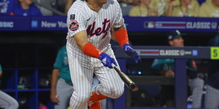 New York Mets catcher Francisco Alvarez hitting a double.