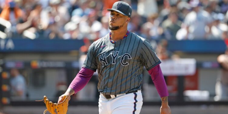 Frankie Montas #47 of the New York Mets walking off the field.