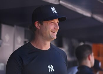 New York Yankees pitcher Gerrit Cole (45) watches the Old Timers play before the game when the New York Yankees played the Houston Astros Saturday, August 9, 2025 at Yankee Stadium in the Bronx, NY.