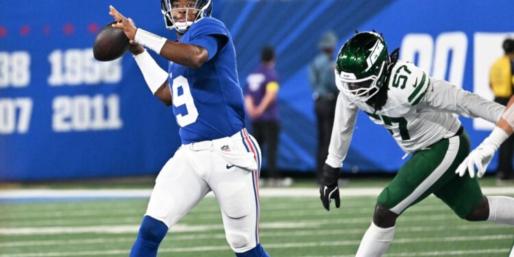 Giants quarterback throwing a football.
