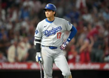 A dejected Shohei Ohtani looks on after lining into a triple play during the sixh inning of the Dodgers' 7-6 loss to the Angels on Aug. 12, 2025.