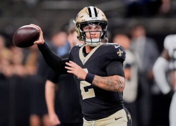 New Orleans Saints quarterback throwing a football.