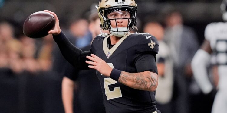 New Orleans Saints quarterback throwing a football.