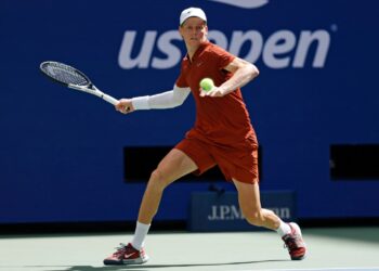 Jannik Sinner playing tennis at the US Open.