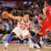 Jeremy Lin dribbling the ball during a Knicks basketball game.
