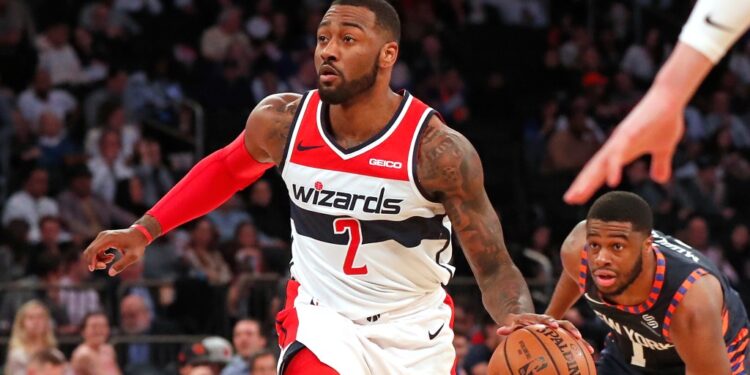 Washington Wizards guard John Wall drives to the basket against the Knicks.