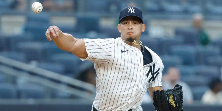 Jonathan Loáisiga throws out Tampa Bay Rays third baseman Junior Caminero during the 9th inning. The New York Yankees defeat the Tampa Bay Rays 7-4 at Yankee Stadium in the Bronx, New York, USA, Thursday, July 31, 2025.