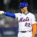Juan Soto #22 of the New York Mets points during a baseball game.Mets outfielder Juan Soto (22) reacts after being walked against the Seattle Mariners in the third inning at Journey Bank Ballpark