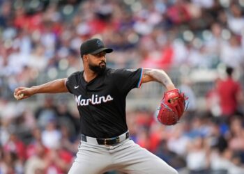 Marlins baseball pitcher throwing a pitch.