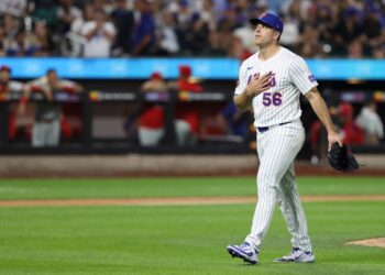 Ryan Helsley, New York Mets pitcher, walks to the dugout.