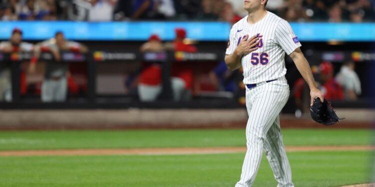 Ryan Helsley, New York Mets pitcher, walks to the dugout.