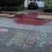 The chalk and red paint outside a Microsoft executive’s home (blurred and cropped to remove details).