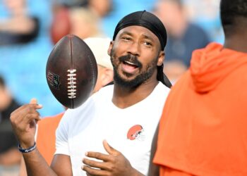 Myles Garrett, Cleveland Browns defensive end, holding a football.