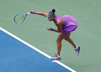 Naomi Osaka serving at the US Open.