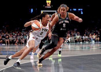 Kelsey Mitchell of the Indiana Fever dribbling the basketball as Nyara Sabally of the New York Liberty defends.