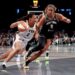 Kelsey Mitchell of the Indiana Fever dribbling the basketball as Nyara Sabally of the New York Liberty defends.