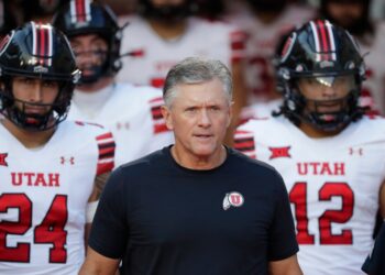 Utah head coach Kyle Whittingham with players.